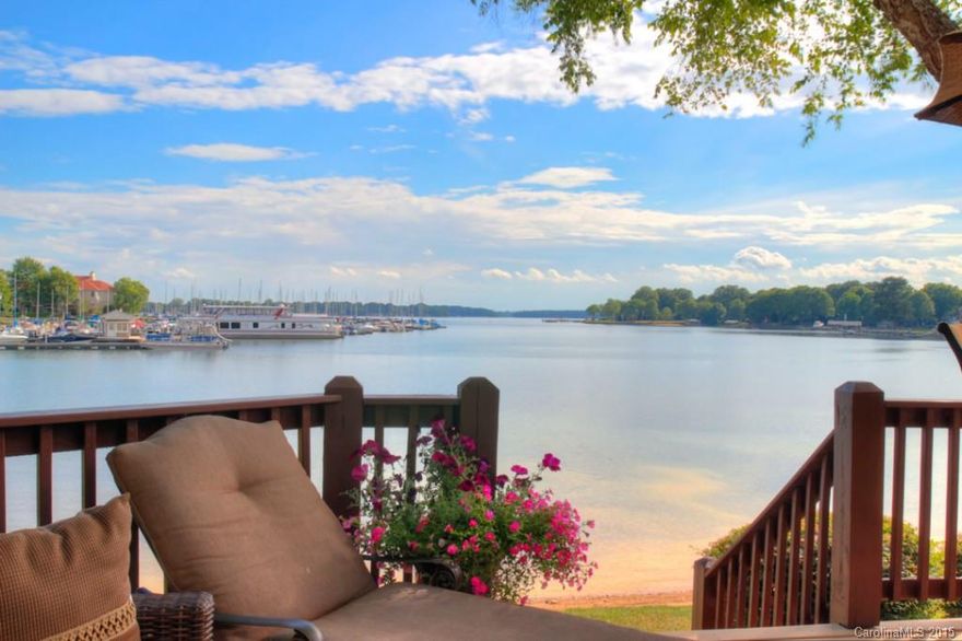 REDUCED JULY 4TH SPECIAL TO $449,000!!!!!Best View IMMUCULATE HURRY WILL NOT LAST LONG!!!  WATERFRONT TWO STORY TOWNHOME 1800 SQ FT  BOAT SLIP #39 AVAILABLE FOR ADDITIONAL $27,000 AT AQ PRIVATE MARINA.  TRUE HARDWOOD FLOORS ON MAIN LEVEL & UPPER LEVEL.   KITCHEN/GRANITE +STAINLESS STEEL WHIRLPOOL APPLICANCES 1.5 YEARS OLD. EXOTIC GRANITE ON WET BAR. FAUX PAINT, UPDATED MASTER BATH GRANITE/ NEW JETTED TUB/ SEAMLESS SHOWER DOORS/VANITY SHOWER SEAT/DECORATIVE TRAVERTINE TILE.    GUEST BATH UPDATED.