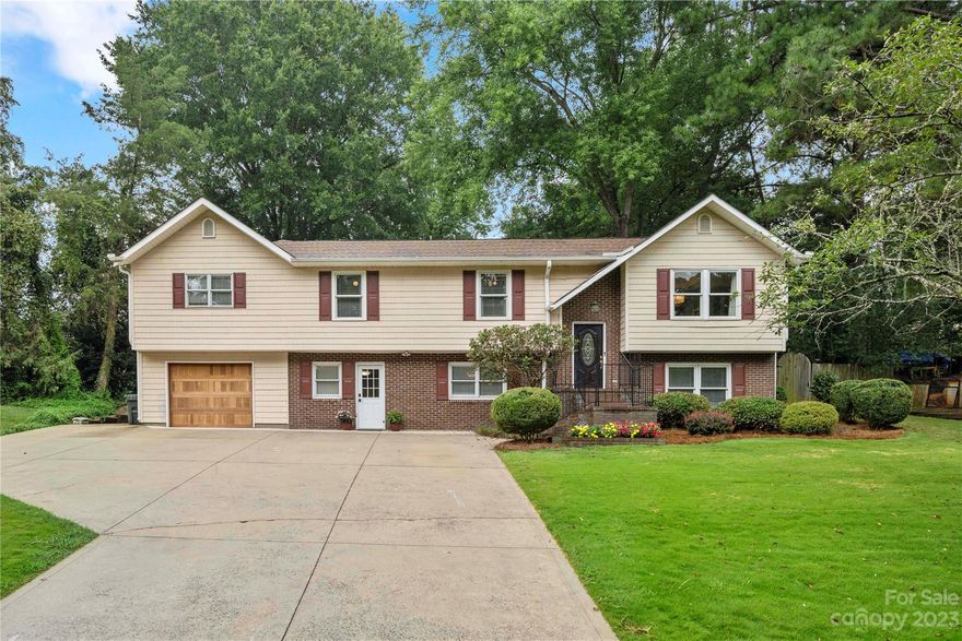 If you are looking for a neighborhood with no HOA, award winning schools, close to the interstates, and a beautiful backyard, this is one you won't want to miss.  Plenty of space with a dining/living room, bonus room, flex room, family room, and an office.  Heated pool, koi pond, gas line for grill on the large screened porch, garden area, berry bushes and fruit trees, and a playset.  It would not take much to make this home a multi generational home, 2nd living quarters, or a suite with private entrance.  There are laundry connections & cabinets installed on basement level already.