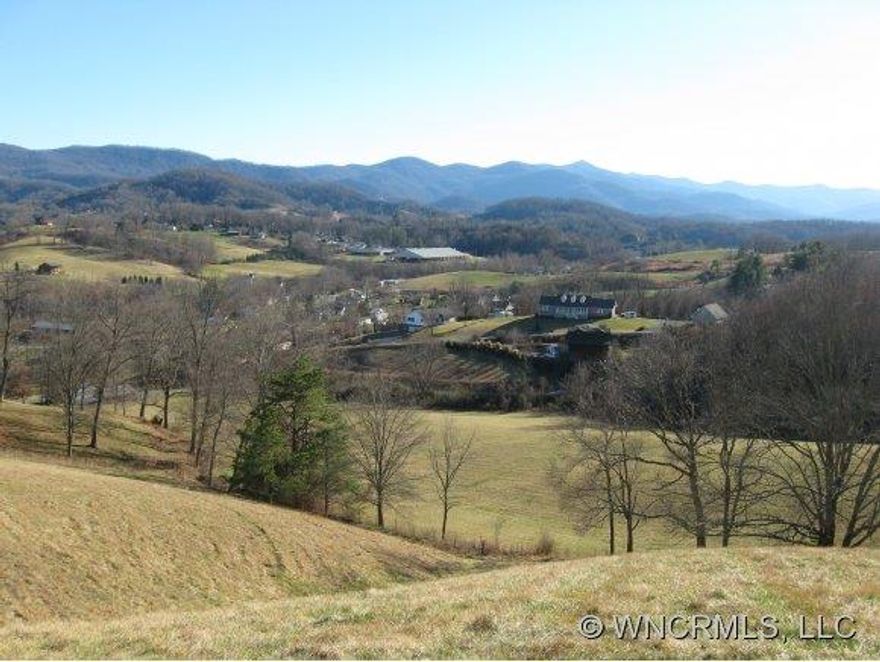 Majestic Views and Awesome Setting centrally located in very nice community near Lake Junaluska. Paved roads and city water. Build your Dream Home on this gentle sloping lot. Must See!!percked for 3 bedrm septic.  2 lots combined to make one.