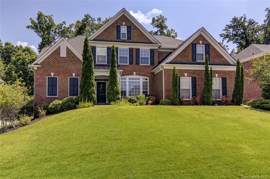 Immaculate full-brick home in Elizabeth Place!  Bright open floorplan includes a two-story foyer and great room w/ hardwood floors throughout the main level living areas.  Double sided fireplace opens to the keeping room, breakfast room and kitchen.  Main level owner suite features luxury bath w/ double vanity, jet tub, separate shower and oversized walk-in-closet with custom shelving.  Upstairs includes three additional bedrooms plus the bonus/theater or fifth bedroom and two full baths.