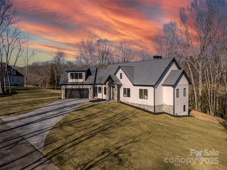 Experience the perfect blend of luxury and tranquility in this brand-new home on 2.13 acres in Fletcher, NC—just minutes from vibrant downtown Asheville. Designed for modern living, this 3-bedroom, 3.5-bath masterpiece features a sleek, oversized kitchen, a stylish office, and an inviting open floor plan. Unwind in the private hot tub, entertain in the spacious upstairs bonus room, or explore endless possibilities in the unfinished basement. With expansive outdoor space for relaxation and recreation, this home is a rare find where contemporary elegance meets mountain charm. Don’t miss out!