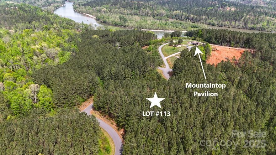 Large Lot for sale with year-round views & lake access! Located in Lake Rhodhiss Estates, a gated waterfront community with extensive views that provides private lake access with dock, boat slips & a mountaintop pavilion with kitchen/bar & scenic rooftop. This lot is 0.79 acres in size with sloping topography overlooking the lake & mountains. Future residence will have a breathtaking view! Located just a few steps from the mountaintop pavilion & bonfire area. City water, sewer & underground utilities available, private roads maintained by the HOA. Lake Rhodhiss is ideal for fishing, boating, water skiing, wakeboarding, paddle boarding, swimming, kayaking, canoeing, and all water activities! Community is convenient to Hwy 70 Morganton, Hickory & Lenoir. Contact Listing Agent for more information!