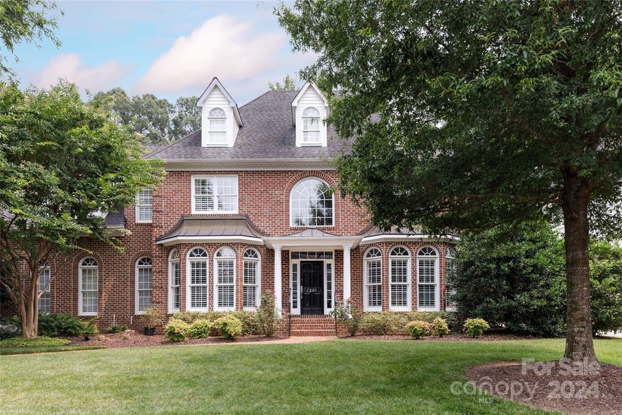 Welcome to 1201 Lost Oak Rd, a beautiful full brick residence providing a genuine charm with a striking first impression. This updated home offers one of the largest kitchen island you will ever see, 2 staircases, 2 new dishwashers, 2 laundry possibilities, 2 ovens, 2 different grills, 3 car garage, 5 large bedrooms, 9 seater hot tub and 1 outstanding mud room! Located in a sought-after area of South Charlotte, where amenities and great schools are conveniently accessible to and from this quiet cul-de-sac street. The improved and well maintained private backyard will please anyone who likes to grill, play, relax and entertain. Extensive millwork, custom walk-in-closets and rooms for all, do not miss the opportunity to create the family home you have always dreamed of.