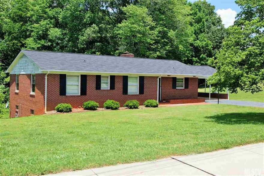 Classic brick ranch in the heart of Granite Falls with 1.78 acres. This 3 bedroom two bath has endless potential. Open kitchen and den has eat in bar and brick fireplace. Kitchen has loads of cabinet space. Large formal living room with large windows. Master has adjoining full bath. Additional bedrooms feature built in's and original louvered closet doors. Hardwood floors just waiting to be uncovered and a full unfinished basement with large fireplace is just begging to be finished!