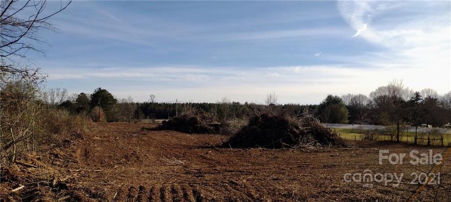 1.49 acre lot zoned R-2 with visibility from US Hwy 64 at Liledoun Rd and frontage on Henry Rose Dr, a paved, State maintained cul-de-sac street.