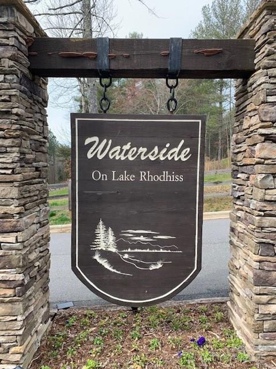 Welcome to this beautiful gated community with city water, sewer, and underground utilities. Choose your private build site on this large 1.9 acre lot. Enjoy a variety of amenities including a community fire pit, recreation area, and convenient lake access just around the corner. Boat slips are available for lease, offering easy access to Lake Rhodhiss—perfect for fishing, boating, water skiing, wakeboarding, paddle boarding, swimming, kayaking, and canoeing. Embrace the lake lifestyle in a well-appointed neighborhood designed for relaxation and outdoor enjoyment.