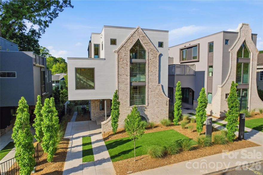 Crafted through a visionary partnership between Grandfather Homes and Elite Design Group, this 5-bed / 5-bath custom residence offers elevated living in Heirloom at Mattie Rose. Main floor features an open-concept layout with dining and great room sliding doors opening to covered terrace with fireplace. Chef’s kitchen showcases Thermador appliances, large island, plus walk-in scullery. Main level office or bedroom with full bathroom. Primary suite offers two generous walk-in closets and bathroom with soaking tub, tile shower, and dual vanities. Third floor is an entertainer’s dream with rooftop terrace and cocktail pool, media room with wet bar, and full guest suite. Low-maintenance artificial turf in the front and rear yards. This artfully curated village of just nine custom homes combines luxury and sustainability in the heart of NoDa, offering walkable access to dining, nightlife, and culture. Come experience "art-itecture"—where every detail is designed to elevate your lifestyle.