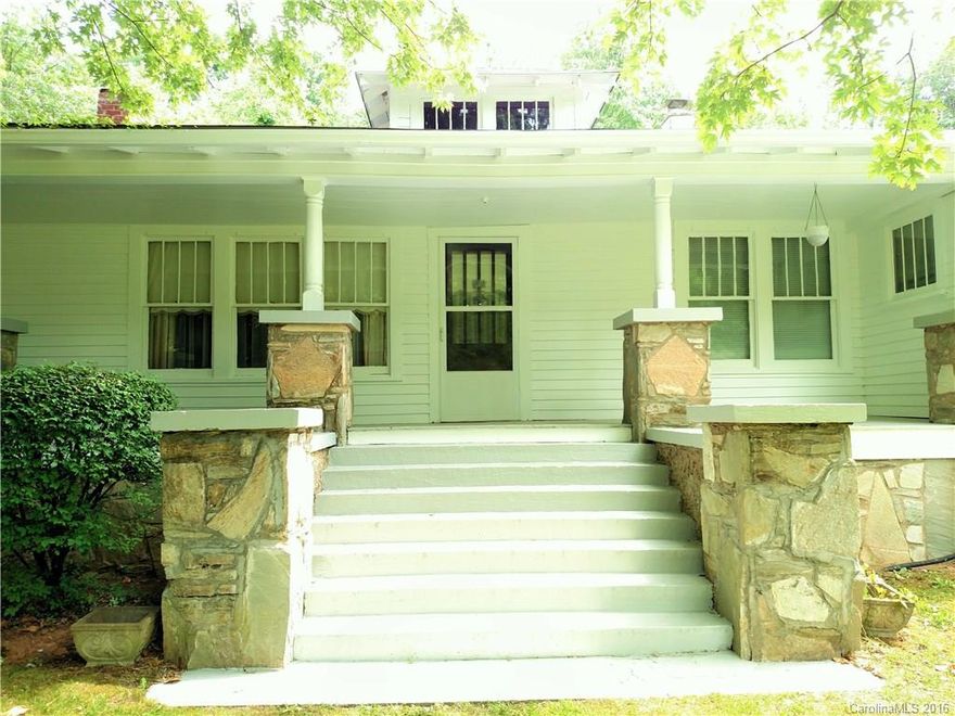 Classic older home built c.1940 or earlier with beautiful bead board and woodwork features. Perfect for antique lover!  Pretty porch looking out at lovely, established yard, and year round creek. Plenty of room for garden. Hardwood floors throughout, 2 car garage, beautiful antique light fixtures, fireplace with electric insert,  Located in Historic Bald Creek District. Easy to commute to Asheville, Weaverville or Johnson City. Motivated sellers