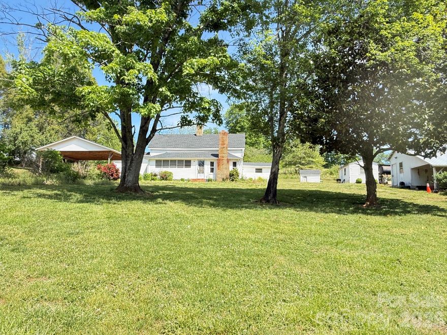 Charming Farmhouse on 1.258 Acres Awaiting Its Transformation!
This delightful home features:
3 bedrooms
1 bathroom
Spacious living room
Functional kitchen and dining area
Come take a look and see how you can make this fit your needs and style!
Nestled in the picturesque foothills of North Carolina, this property is just a short drive from Taylorsville and Wilkesboro.
Home being sold "as-is"
Note:  According to the seller, the shingles on the house, carport, and all other buildings were replaced approximately three years ago. The ceiling height in the living/dining areas and one of the bedrooms is under 7'. There is a monitor oil heater for heat but no ac in the home.  An old well is located inside the utility room of the house and covered with plywood. Property being sold is a portion of a 10+ acre tract and is tract #2 of the plat in photos.