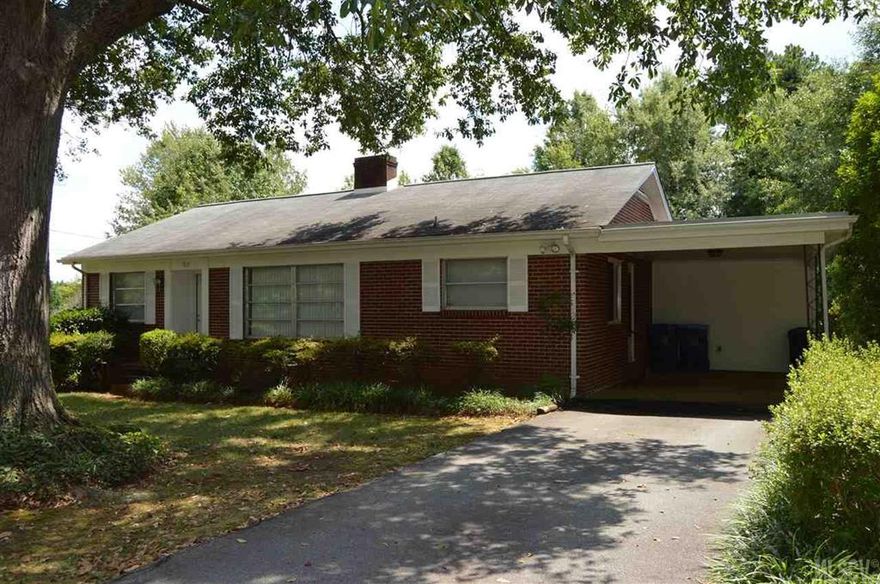This charming three bedroom, two bath brick home offers a functional single level floor-plan and is located near the conveniences of downtown Hickory.  This home features a spacious living room with brick fireplace, eat-in kitchen with ample cabinet storage space and counter-top preparation space and three well appointed bedrooms, all with good closet space and nice windows.  The master bedroom offers a spacious private en-suite bathroom and convenient laundry facility.  This home also offers a full unfinished basement that provides additional storage or work-shop space.  An attached single-carport provides a protected environment for vehicles or lawn equipment.  This home offers a level lot with mature trees and plenty of space to play or entertain.  Located just minutes from US-321 and I-40.