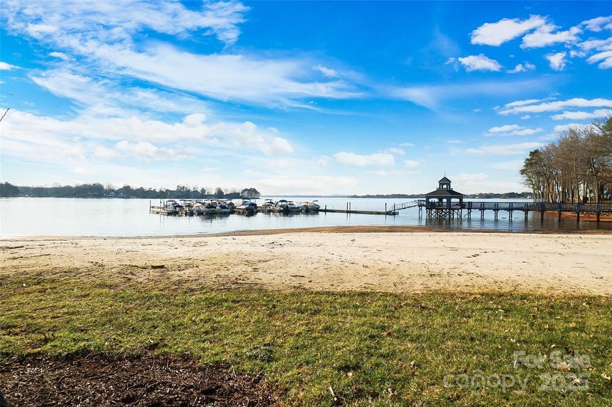 Rare opportunity to own a ground floor, 3-bedroom, lakefront condo in the desirable Portside community of Davidson Landing. Stunning full lake views & direct access to one of two white sand beaches. Large covered patio to enjoy the long-range views & spectacular sunsets over Lake Norman. Ideal spot for morning coffee, evening sunsets and entertaining. The master retreat features an on-suite bathroom & direct lake views. Kitchen features Bosch s/s appliances, white/grey painted cabinets & more. Many updates include: carpet, flooring, paint, light fixtures, fans, f/p, blinds & more. Updated Master Bath w/ spacious walk-in shower. Closets by Design Master Closet & Laundry Room. New water heater in March 2025. Community amenities include pool, beaches, tennis/pickle ball/basketball courts, walking trail, kayak/paddle board storage, picnic tables. Enjoy lakefront walks on the boardwalk or relax on your private beach. Explore shopping, restaurants & attractions of downtown Davidson.