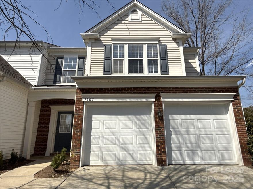 Welcome home! This end unit with fresh paint and new carpet is ready for you! It has a 2 car garage, patio, hardwood floors downstairs, gas log fireplace, spacious open floor plan w/gorgeous smooth surface kitchen countertops, cherry cabinets, stainless appliances. 3 spacious bedrooms, luxury main bath with garden tub & separate shower, huge walk in closet. Washer/dryer remains. Just seconds to community pool.  Please note, renters insurance is required.