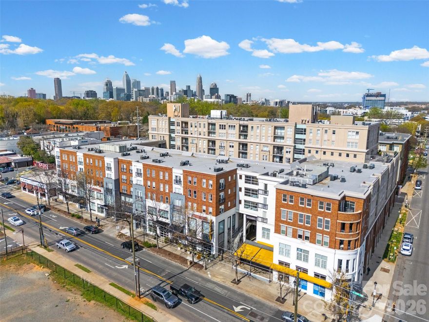 Don't miss your chance! Luxury living on the top floor of the highly sought-after 1315 East Blvd building, this rare 2-bedroom, 2-bath condo offers the perfect blend of style, comfort, and location in the heart of beloved Dilworth. Thoughtfully updated throughout, the home features newer luxury vinyl plank flooring, all-new light fixtures, tasteful moldings, and custom closet systems in both bedrooms.

The spacious open kitchen is both functional and inviting, showcasing recently painted cabinetry, granite countertops, a tile backsplash, and stainless steel appliances—including the refrigerator. A washer and dryer are also included for added convenience.

The bright and airy living room is anchored by an expansive sliding glass door that opens to a private balcony overlooking the serene courtyard and fountain—an ideal spot to relax or entertain.

The generously sized primary suite offers a walk-in closet and a beautifully updated en suite bath complete with a quartz countertop, framed mirror, rich stained cabinetry, a custom tile shower with glass enclosure, and designer tile flooring. The secondary full bath has also been stylishly renovated with similar high-end finishes, including a quartz countertop, framed mirror, updated cabinetry, and a tile-surround tub/shower combination.

Residents of this well-maintained building enjoy access to a fitness center, a stunning rooftop terrace, and a dedicated parking garage. All of this is set in a premium location just steps from local dining favorites, shopping, grocery stores, Freedom Park, Atrium Hospital, and everything Dilworth has to offer.