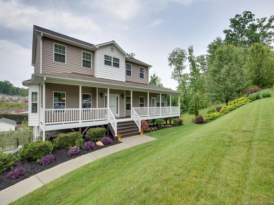 Beautiful home on rolling manicured lot just minutes from shopping, dining and downtown Asheville!  The spacious interior features an open kitchen with room to work, formal dining and beautiful wood flooring.  Step outside and enjoy your morning coffee from the rocking chair front porch or the screen back porch, it's your choice!  Two car garage.