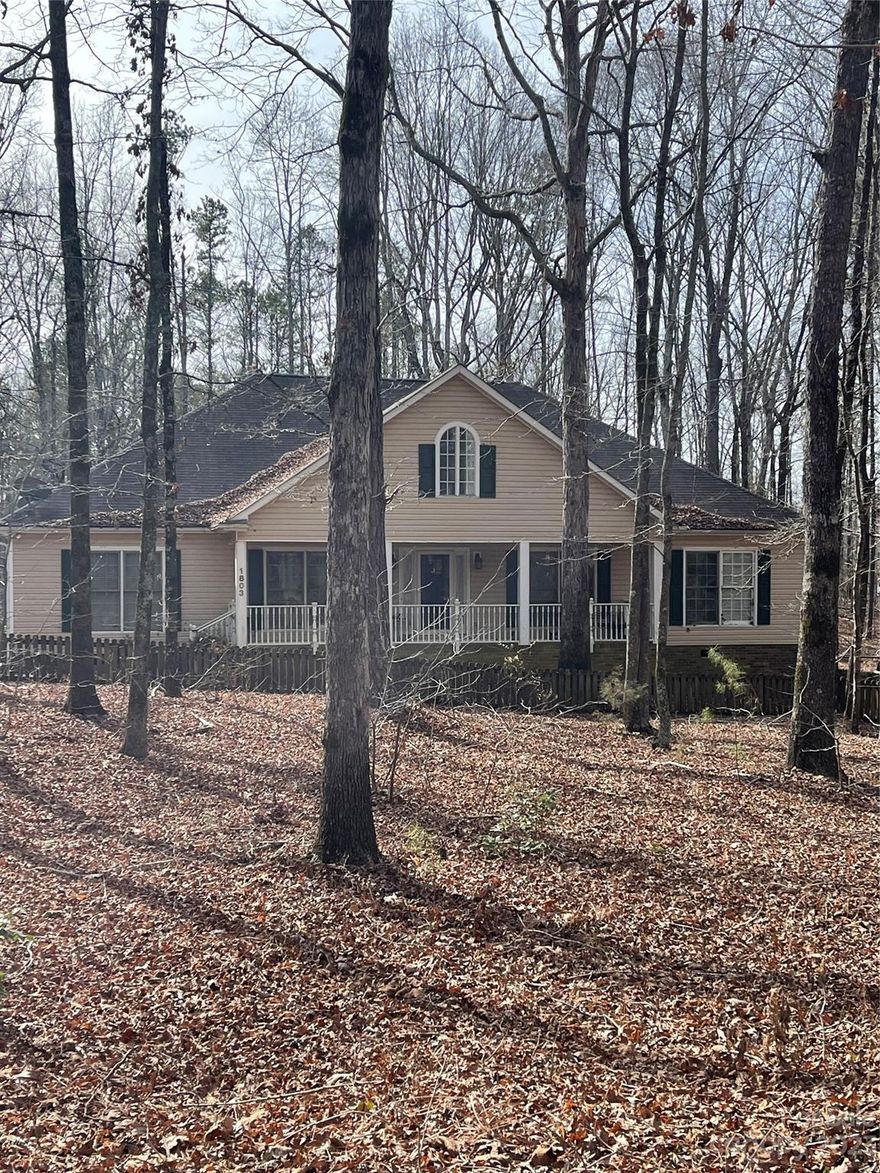 Welcome home! Country living but so close to the City. This custom spacious ranch that's nestled on 3.2 acres is ready for your personal touch. Open floorplan, that is perfect for entertaining with screened porch and large open deck. Plus Installed gas line for outdoor grilling.  Home office/flex room on main level, split bedroom plan with finished bonus/play room upstairs with sink and cabinets.  Generac Solar panels with Pink energy installed 2021.  
3 car extra long garage has plenty of room for storage or workbench. 80x80 fenced in area for dog/pets. Outdoor storage building. Plenty of parking and RV parking. NO HOA! Seller offering $10K towards new flooring allowance. Seller is open to any reasonable offers! This is the one that you’ve been waiting for!