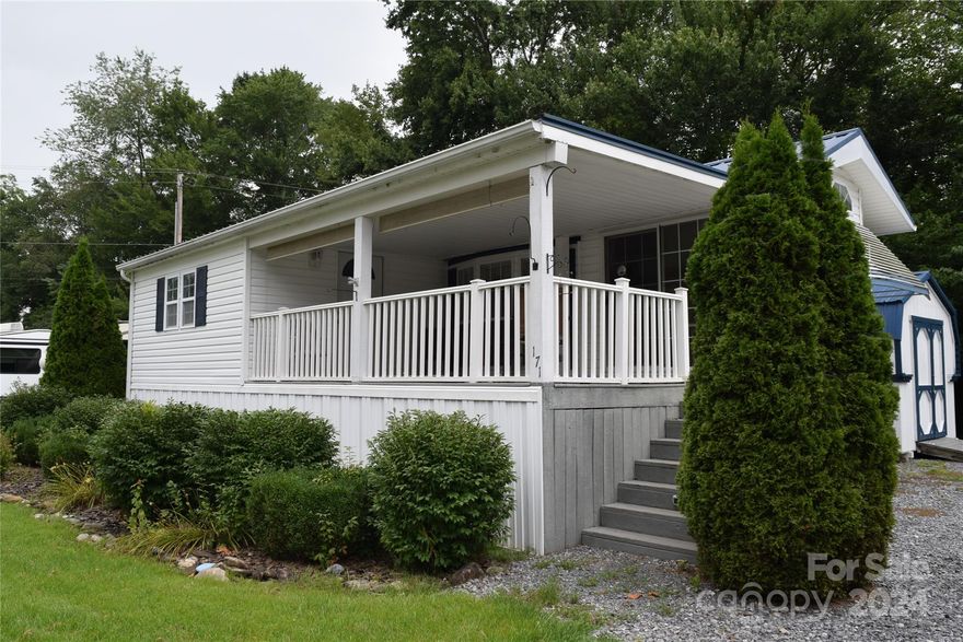 The perfect Smokey Mountain Getaway with views in the quiet, friendly and popular neighborhood of Dogwood Lakes Development. This beautiful park model with add on has a newer HVAC system, new plumbing, granite countertops, a large bedroom 11'x14'. Outback you will find two spacious sheds, great for storage of golf cart. Also, this backyard has a nice private area that could be great for a firepit. The home is located on two lots, so it does have a large parking area. These homes sell fast, don't wait!