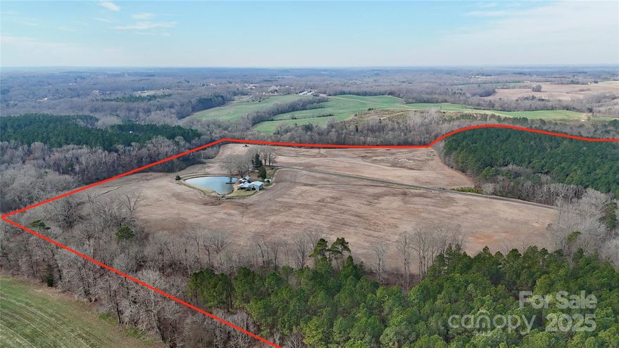 92 acres of paradise with a 120 year old cabin overlooking your own pond seemingly in the middle of nowhere but minutes to Marshville.  This tract has ample road frontage on both sides of Lucy Short Cut and borders Salem creek on the north side.  Great mixture of farm land and a small pine plantation offers numerous opportunities.  New owners could subdivide and build a few homes or keep in it's original state.  Cabin being sold as is with no value.  Over 2000 ft of road frontage and 5 minutes to Eagle Chase Golf Course