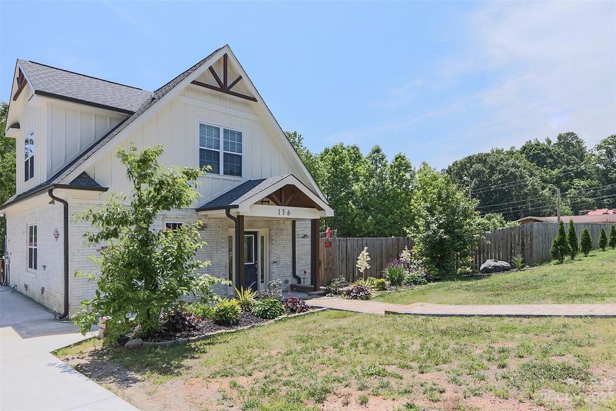Beautiful custom new construction home with no expense spared! This fantastic 'whitewashed' partial brick home is the one you have been waiting for. Walk down the pavestone sidewalk to the front door with covered vaulted front porch with stamped style concrete. Inside you'll notice the unique engineered hardwood flooring, the TALL ceilings. The amazing kitchen with eat at bar & dining room. kitchen features SS appliances, granite countertops with a brushed like finish. Main level primary bedroom with resort style ensuite with beautiful shower w/ multiple jets shower head. Granite vanity with modern fixtures & gray tile flooring. Walk-in closet with custom shelving. The gray interior doors throughout compliment the neutral choices throughout. Upstairs takes you to the bedrooms with sitting area/office and great second bathroom with custom shower. Your own retreat outside has massive in-ground pool, volleyball court, firepit, covered patio w/bar perfect for entertaining.