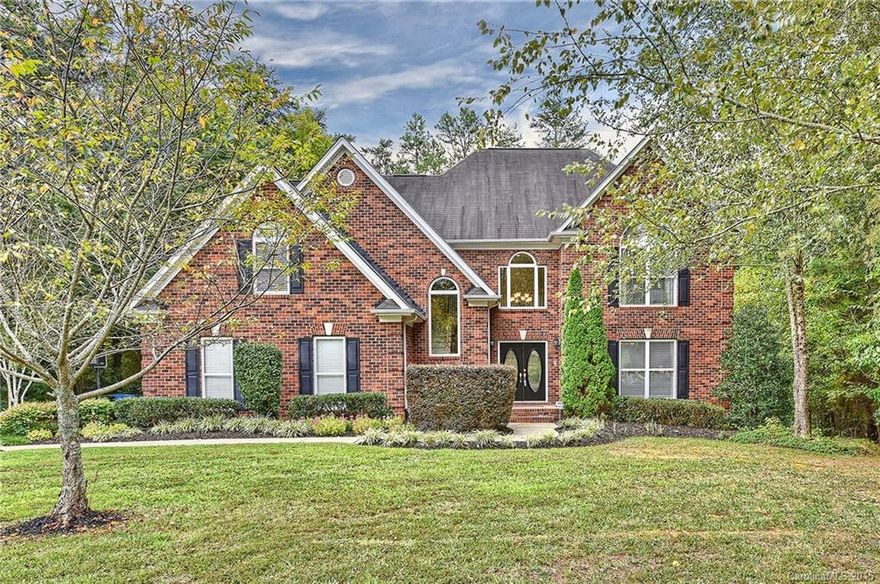 Immaculate full brick home on beautifully landscaped, wooded lot! Features include: hardwoods on most of main, formal living and dining room, loaded kitchen featuring granite counters, stainless appliances, center island, and large pantry,spacious master suite, master bath featuring dual vanity, garden tub and separate shower,4th bedroom/bonus with built-ins, over-sized 2 car side load garage, large deck overlooking private back yard that is beautifully landscaped. Convenient Mint Hill location!