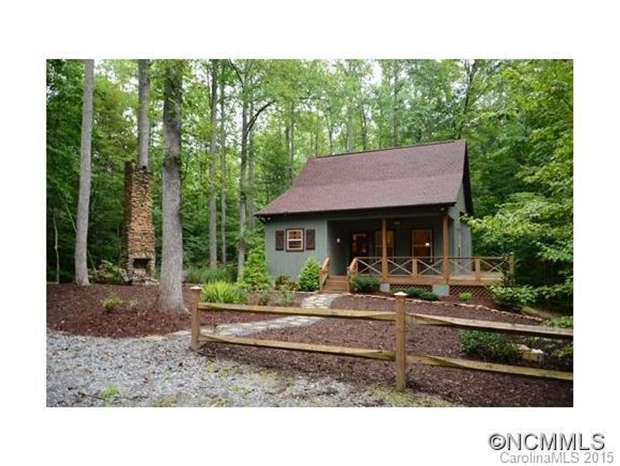 Beautiful Southern Homes floor plan with gas stove and log fireplace, 2 bedrooms & 2 baths with a wrap around porch and deck. There is an old chimney from an old cabin in horse and buggy days. Come see for yourself. Stream at the bottom of the property is a spring fed as well as rain fed stream.