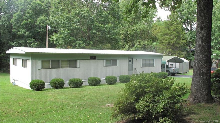 This 3 bed/2 bath home is the perfect place to enjoy the beauty of nature on its large (1.018 acre!) well maintained yard. Enjoy plenty of outdoor storage space in the 3 outbuildings. Interior features include living area, family room, ample closets, & washer/dryer included. Convenient location just minutes to shopping and interstate, yet extremely private. This affordable and move-in ready home won't last long, so come see it today! While inspections are welcomed, property is being sold AS-IS