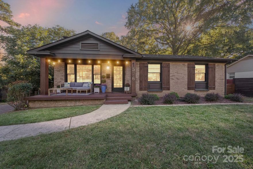 One-of-a-kind modern ranch that feels straight out of a design magazine. This fully reimagined 3BR/2BA brick home combines creative engineering with timeless craftsmanship. Inside, exposed beams soar over an open-concept living space anchored by a sleek concrete island, gas range, and retractable pass-through window that opens to a stunning two-tiered party deck. Custom cabinetry, dual sinks, and curated lighting make this kitchen an entertainer’s dream. The vaulted living room showcases a shiplap fireplace and built-in bar area with walnut counters and designer finishes. Primary suite with built-ins and an updated spa-style bath. Secondary bedroom features a custom bunk/study system, with the third bedroom ideal as an office. Outside, enjoy a flat, fenced .4-acre lot, detached 500+ sq. ft. workshop/garage, and front porch perfection under café lights. Every detail here was designed with intention. Rarely does a home like this hit the Charlotte market—prepare to fall in love.