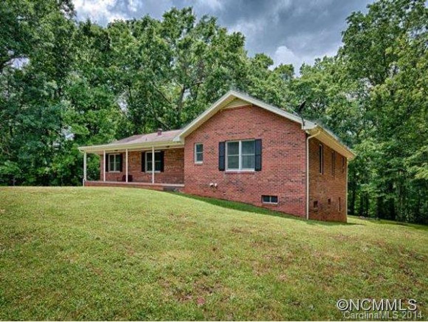 Private location. Enjoy the view from your front porch. 3br/2ba brick rancher with full basement. Two car garage, deck, fireplace, outbuilding, workshop all located on 2.6 acres.