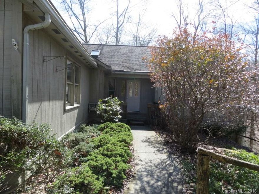 Well priced and conveniently located home perfect for year round or vacation. Open Great Room with Stone Fireplace and split bedroom plan. Great location close to the Clubhouse and all amenities. Large Screened porch has privacy to enjoy summer evenings. Good size Kitchen with hardwood floors and lots of cabinets. 1314 square ft finished and heated space in basement is accessed from exterior stairs and perfect for office/studio. Buyer to pay amenity fee of $8000 at closing.