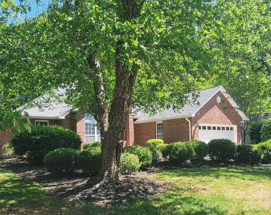 Step inside to discover a beautifully maintained all-brick home that's been updated throughout, starting at the entrance with designer floor patterns made of marble and slate, to the custom trim work, to the custom light fixtures in every room. The remodeled kitchen area features higher-end appliances, sleek granite countertops, beautiful custom cabinets, with ample storage space, glass and stainless steel vented hood, a kettle faucet, quartz backsplash and a see-through fireplace leading into the great room, designer sink basins and faucets in both bathrooms, 10 ft. ceilings throughout gives the home that touch of elegance and bright open space feeling. Primary suite on the main level with a luxurious upgraded master bathroom that includes a French-style multi. jet soaking tub, a theraputic spa like walk-in shower, including a musical sound system, heated and LED lighting, heated marble flooring, and your very own heated bidet toilet. 2 separate attic access areas, for plenty of storage above. The sunroom opens onto a spacious patio and deck overlooking a private, fenced-in yard, ideal for taking in the tranquility and creating your own little slice of serenity in your backyard. This distinctive home is nestled in the heart of Fort Mill and offers a perfect blend of privacy, space, and convenience. Just five minutes from shopping, grocery stores, and dining options, Lake activities, golf courses, and less than 3 miles to I77. Get an appointment to preview today, you will not want to miss out on this gem!