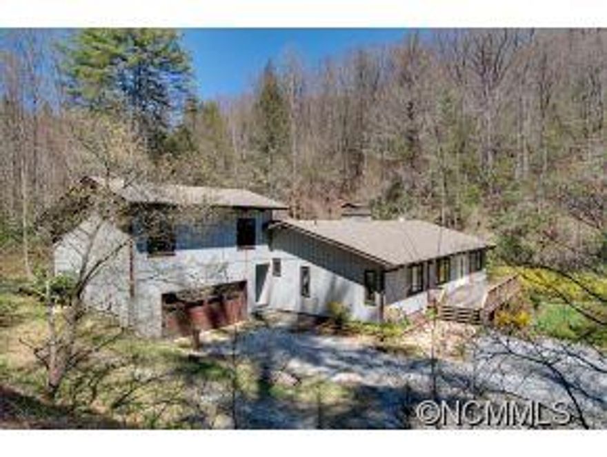 Large home secluded on 9 acres. Borders the National Forest. Perfect for a large family or could be used for a hunting or fishing camp. Huge stone fireplace, 2 car garage with a large workroom, exposed beams, wood floors throughout, bonus rooms upstairs, crawlspace has an automatic dehumidifier, beautiful bold flowing stream, spring room in garage for storing your wine, a must see!