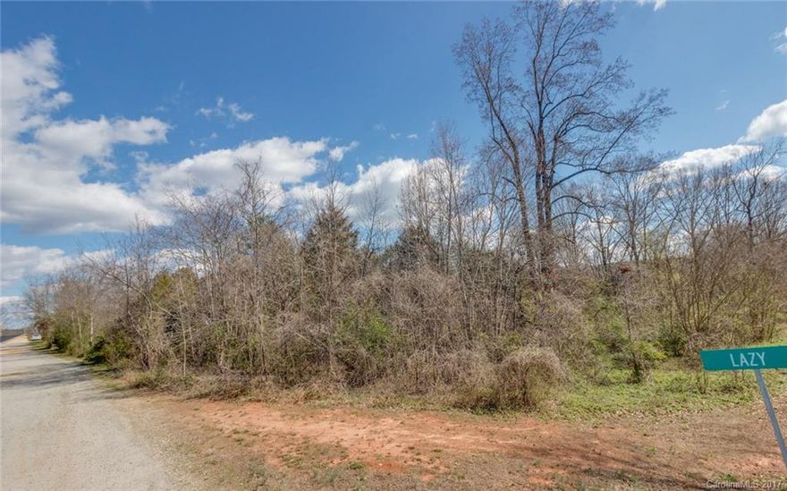 This beautiful, level, and wooded lot is located in the Cozy Cove subdivision. Deeded Community Lake access lot . Amazing location! Just minutes to Highway 150 and Highway 16.