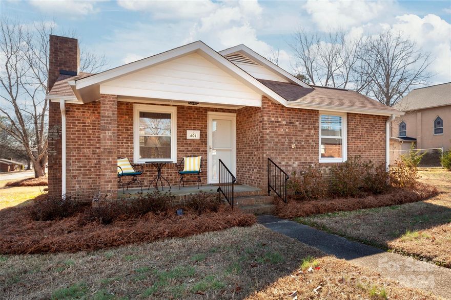 Cute-as-can-be cottage on a great corner lot with easy access to Highway 321. All brick construction with nice upgrades including 5' gutters, added attic insulation, LVP flooring, fresh paint, glass/screen storm doors and an electric tankless hot water heater. There's a charming covered front porch, overlooking the front yard. Out back, there's a 512 square foot storage/workshop building with power and a carport/shed. The house offers 2 bedrooms, 1 nicely updated bath, an eat-in kitchen and a light-filled living room, plus a back entry with laundry. Washer/dryer and refrigerator convey. Located just 5 blocks from Downtown Dallas, with restaurants and more. Welcome home!