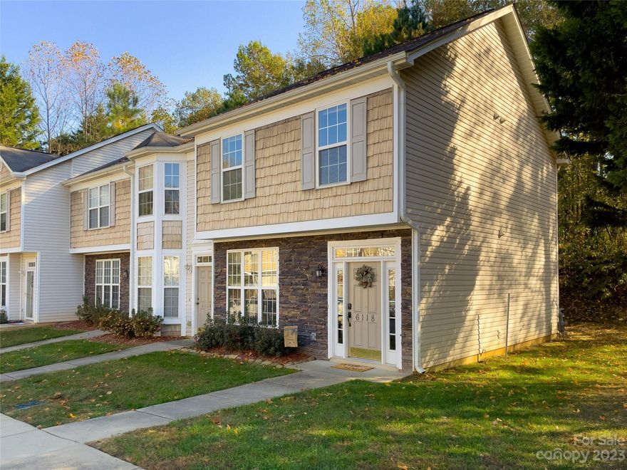 Ready to enjoy easy-maintenance townhome living with this desirable 3 Bed/2.5 Bath 2002-Built END UNIT? Situated on a dead-end street means less thru-traffic PLUS this unit is one of just a few to have lovely trees beside and behind it, offering a natural buffer. Brand new carpeting upstairs! The floorplan offers an airy, spread-out kitchen layout and a bright dining area near the triple window array. Fridge/washer/dryer included! Your primary bedroom retreat offers vaulted ceilings & fan. No worries about your landscaping, exterior, and roof maintenance—the HOA has you covered!  The rear offers a peaceful paved patio area ready for your grill and outdoor table set. Nestled in a quiet community but close to the conveniences we all love: grocery, restaurants PLUS pickleball courts, a dog park, fishing, and jogging trails at nearby Dallas Park. Located right near 321 for easy access to Charlotte or wherever you need to go. 2 assigned parking spaces included.