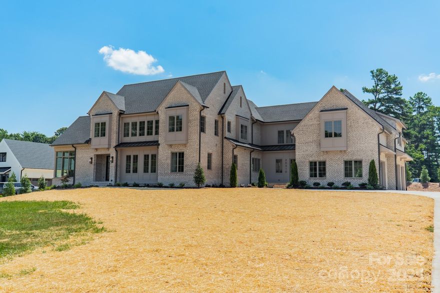 Proposed completion: May  2025. Discover an exceptional new construction opportunity in Cornelius, thoughtfully designed by Eric John Builders.This meticulously crafted home offers 5 bedrooms, including 2 on the main level, along with 2 versatile bonus rooms and abundant outdoor living space featuring a large covered terrace and room for a pool. The chef-inspired kitchen is a masterpiece, boasting a spacious scullery, locally crafted designer cabinetry, quartzite countertops, a stylish tile backsplash, and a premium Wolf/SubZero appliance package. Select-grade white oak floors, finished on-site, add warmth and elegance to the main living areas.The primary suite on the main level is a luxurious retreat, complete with a massive walk-in closet with a washer/dryer, a freestanding soaking tub, a frameless glass-enclosed shower, and natural stone countertops. Upstairs, you'll find 3 additional bedroom suites,loft, bonus room, and a 2nd large bonus/playroom—ideal for entertaining or relaxing.