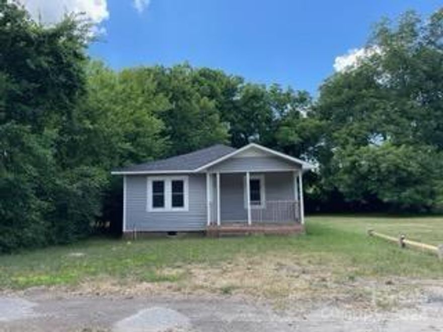 Darling invesgtment property ready for you to put your stamp on it! Home in great location, but needs some updates. Some updates already done include new ROOF and Flooring! Home priced such that seller is not willing to make ANY updates. Fireplace in living room is non-working.