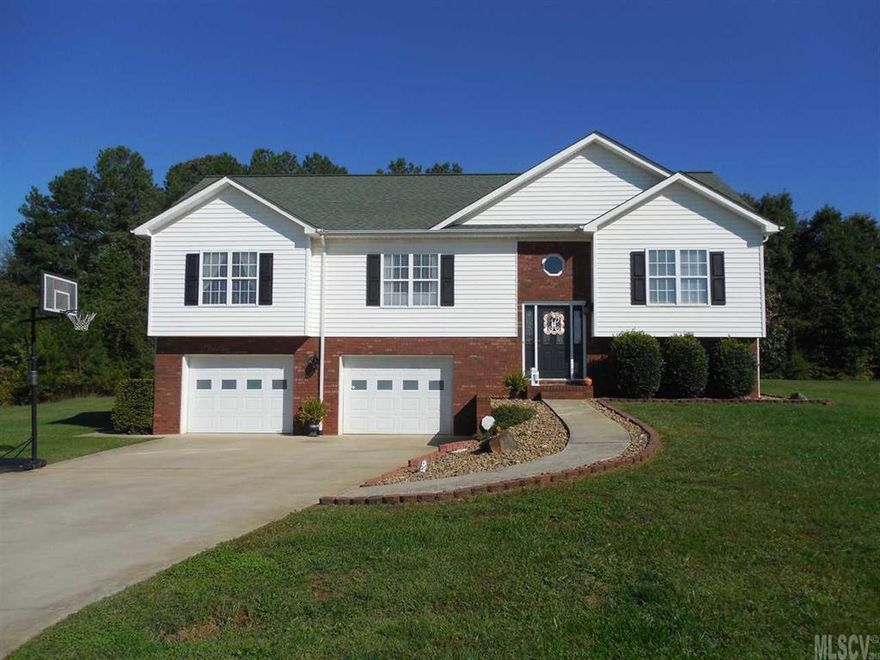 This home is move-in ready. Three bedrooms, two baths, great room with gas log fireplace & the basement has a den that's perfect for a rec room. Tile flooring in the basement. The kitchen has a bar area & lots of cabinets. The interior was painted in 2015. Many updated light fixtures. The great room & kitchen has cathedral ceilings. The master bedroom has a walk-in closet. The master bath has a garden tub & separate shower. Nicely landscaped.