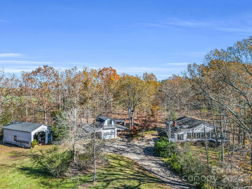 Nestled on 7.2 peaceful acres, this property combines country charm with modern convenience just minutes from Main Street and downtown. The home features 3 bedrooms, 2 full baths, and a large living area with built-in bookshelves, a gas log fireplace, and abundant natural light. Beautiful hardwood floors flow into a cozy dining area and a kitchen with an island, a small desk nook perfect for a coffee station, and a laundry room.
The primary suite offers a spacious closet and a bath with a tub/shower combo, while two additional bedrooms share a hall bath with a walk-in shower.
Outside, enjoy multiple outbuildings, including a single garage with loft, two attached single carports, and a large high-clearance carport ideal for oversized vehicles. A barbecue pit area adds outdoor entertaining options.
This serene property is a rare find, offering 7.2 acres of privacy and convenience. Don’t miss this opportunity—schedule your showing today! Horses allowed.