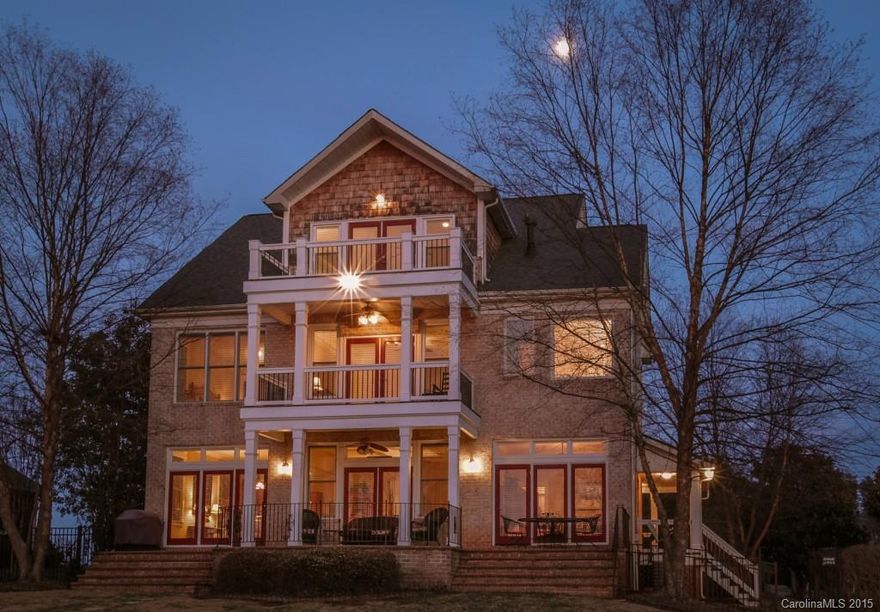 Fabulous family home w/ a vacation feel! Great investment/vacation rental opportunity! Waterfront beauty w/lake views from nearly every room in the house. Main channel open water w/pier, covered dock & lift for all your boating adventures, huge fenced backyard. Lovely coffered ceiling in great rm & media rm, gourmet kitchen, tucked away on the 3rd level a retreat/guest suite w/great view. Showplace home w incredible lake living features to enjoy year round! Hwy16 for easy access to Charlotte.