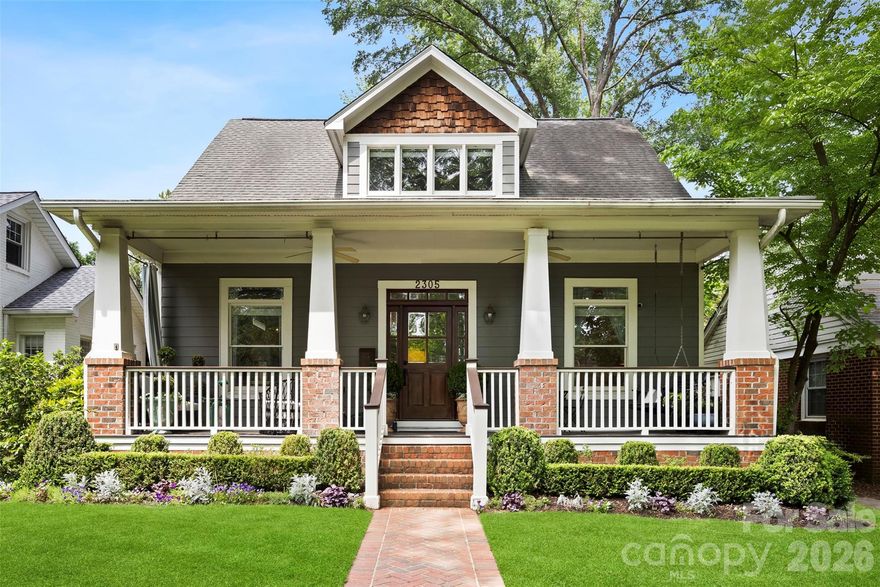 Beautifully renovated and full of charm, welcome to 2305 Shenandoah Avenue, an exceptional Craftsman residence nestled in the heart of highly sought after Chantilly on one of the neighborhood’s most charming tree-lined streets. Blending timeless architecture with thoughtfully curated modern updates, this beautifully designed home offers refined finishes, functional living spaces, and designer-inspired touches throughout.

A large, inviting front porch welcomes you into the light-filled interior featuring 10- and 11-foot ceilings on the main level, refinished hardwood floors, extensive millwork, and a striking coffered ceiling in the great room. The versatile floor plan offers multiple living and entertaining spaces designed for both everyday comfort and elevated hosting, including gas fireplaces in both the living room and family room that create warm and inviting gathering spaces throughout the home.

A standout 2024/2025 architectural renovation transformed a former two-story open area into two beautifully functional levels, creating an expansive family room on the main floor complete with a custom lacquered built-in bar and hidden storage, while the upper level provides the perfect flex space for a playroom, media room, office, or additional lounge area. A whole house audio system further enhances the home’s seamless entertaining experience.

The gourmet kitchen serves as the centerpiece of the home, showcasing stunning White Rhino marble countertops, designer unlacquered brass hardware, a large center island with abundant prep and gathering space, stainless steel appliances, gas range, walk-in pantry, and seamless flow into the dining and living spaces, as well as a three-season EZE-Breeze porch with cedar lining and updated tile flooring. Every detail has been thoughtfully considered, from designer lighting and curated wallpaper selections to freshly painted interiors that highlight the home’s incredible natural light.

Upstairs, the privately tucked-away vaulted primary suite offers a serene retreat with sophisticated finishes, dual custom cedar closets, and a spacious feel. Two additional bedrooms and a versatile flex space with custom built-in cabinetry and office space complete the upper level. Additional highlights include a main-level guest bedroom with an updated bath, three separate living spaces, a butler’s pantry/storage closet off the dining room, and hidden under-stair storage ideal for coats and small appliances.

Outdoor living is equally impressive with custom landscaping and a private rear yard designed for year-round enjoyment, entertaining, and relaxation. Alley access and a detached two-car garage provide additional functionality and storage opportunities. The home also enjoys access to the beloved side street, often used by neighbors for bike riding, pickleball, and community gatherings.

Located just minutes from Uptown Charlotte, neighborhood parks, dining, shopping, and entertainment, this exceptional Chantilly home offers the perfect balance of historic Craftsman charm, elevated design, and modern livability.