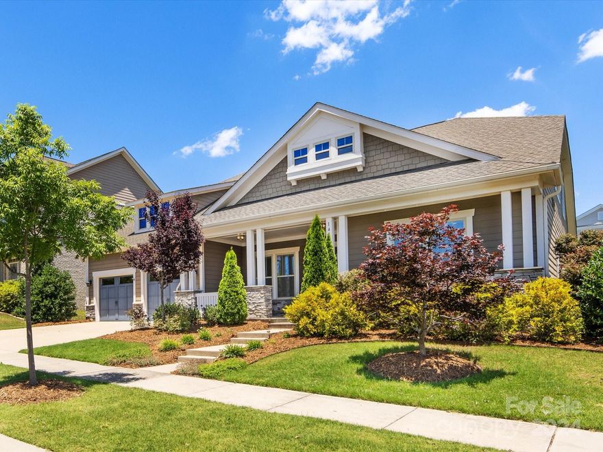 Rare find in Masons Bend- stunning 1.5 story home built by Fielding! This 4 bedroom, 3.5 bath gem lives mostly on the main floor with the primary suite, 2 add'l beds sharing a bath & a dedicated office. Spacious, functional & open-concept floorplan. Kitchen wows with white cabinetry, quartz counters, large island and designer backsplash tile. Butler's pantry features butcher block counters, 2 beverage refrigerators & open shelving. Primary suite is bright and spacious with 2 closets. Luxurious finishes and oversized shower in primary bathroom. Upstairs provides a versatile loft, bedroom and bathroom. Relax to the screened porch with gas fireplace or head outside to the patio and fenced yard. Pocket park across the street! Community amenities: outdoor pools, clubhouse with gym, playgrounds, walking trails, and Catawba river access.