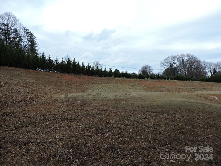 GREAT lot ready for your DREAM home! Location is ideal right off !-40 Interstate and across the street from Rock Barn Country Club.  Bring your Custom Builder. TONS of the work has already been done for you! Septic Design, Perc Test, and Septic Permit all available! BIG lot with potential for any kind of new build you could imagine!