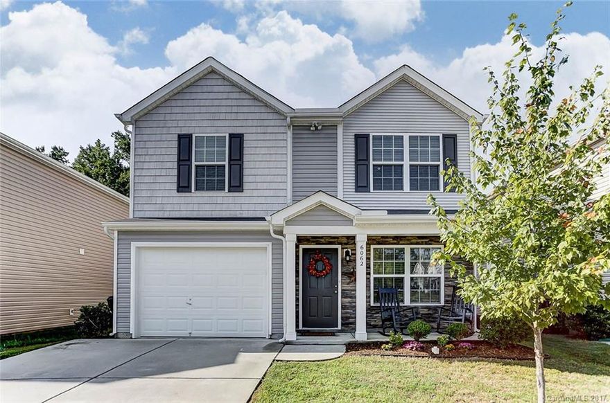 Absolutely gorgeous move-in ready home filled with upgraded features! Upgraded with beautiful wood floors downstairs and gas fireplace in the family room. Enjoy pantry & breakfast bar with seating for 4 in the large kitchen. Luxurious master suite w/ vaulted ceiling upgrade, and deluxe garden tub, double sink vanity and walk-in closet! Plant your own organic produce in raised bed adjacent to the patio. Epoxy coated garage floor! Community Pool! Close to Ballantyne & Fort Mill! Must see!