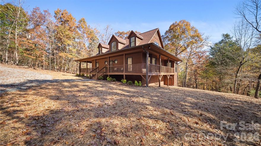 If you are desiring privacy, space and unlimited potential with NO HOA - this is the one! Tucked away on just under 2.7 wooded acres, **now with an optional additional 3.55 acres that can be negotiated as part of the purchase (for a total of 6.23 acres) at an additional price (contact listing agent for details). This beautifully renovated 3-bedroom, 2.5-bath home offers both seclusion and convenience—just minutes from downtown Mt. Pleasant’s charming dining and shopping area. 

You will be warmly greeted by a cozy, covered front porch - perfect for morning coffee, relaxing with a good book or enjoying evening breezes. Step inside to find fresh paint, modern lighting, and an updated kitchen featuring refreshed cabinetry, granite countertops with peninsula seating, stainless steel appliances, and a sunny bay window breakfast nook. A formal dining room just off the kitchen features a second charming bay window that overlooks the side deck and serene wooded views.  This flexible space is perfect for entertaining and could also easily serve as a home office or a playroom. The main level laundry room is located steps from the kitchen and can double as mudroom with an exterior door to the side deck, providing ease to daily routines and offering practical storage/organization solutions. The open living room boasts cathedral ceilings, rich natural light, and sliding doors that open to the expansive wraparound deck that invites you to grill, entertain, dine outdoors or unwind with a glass of wine, making you feel completely immersed in nature and a world away from it all. 

The main-level primary suite offers a spa-like retreat with an oversized walk-in tiled shower and quartz countertops on your double vanity. Upstairs you’ll find two spacious bedrooms, a full bath, and new carpet throughout. Red oak hardwoods flow through the main living areas, complemented by new LVP in the kitchen, laundry, stairs, and second-floor bath.

The unfinished walkout basement offers endless possibilities for future expansion, workshop, storage or even a garage, providing an additional 1,383 square feet of opportunity to finish as you choose. 

Enjoy the feeling of being tucked away in nature while being close to all the charming amenities that Mt. Pleasant has to offer—this is the best of both worlds!