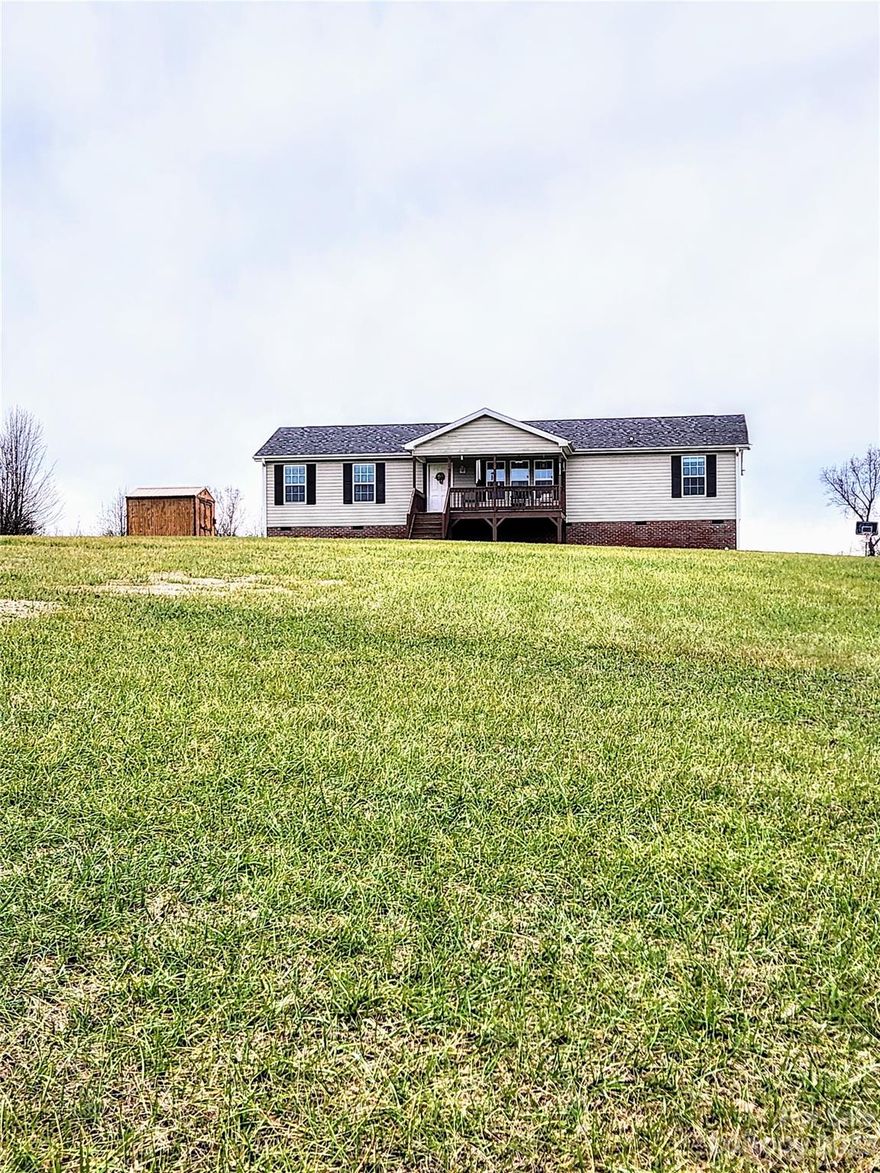 If you're looking for a rural setting, this well maintained 1500 square foot off frame modular home situated on 1.85 acres will be one you want to take a look at.  Built in 2015, the 3 bedroom 2 bathroom home has a split bedroom floor plan with a very spacious primary bath including a dressing area.  The large utility/laundry room provides good storage and work space.  The open floor plan works well for current day living/entertaining needs.  There is a storage building that conveys with the property.  This location provides easy access to Albemarle, Mount Pleasant and Concord.