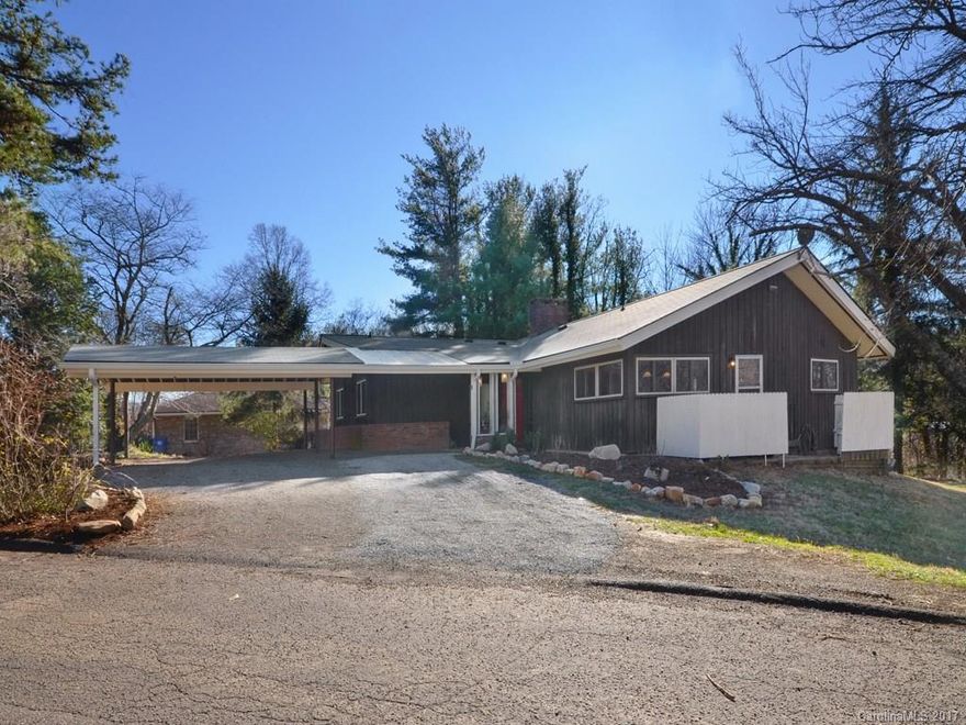 Experience the convenience of North Asheville in this spacious home situated on large lot & 1/2 for plenty of garden & play area. Walk into a massive great room with brick fireplace with gas logs & hardwood floors. Kitchen has beautiful cabinets & hardware with high end stainless appliances.  Master suite, bedrooms & laundry are all on the main level.  Lower level has TONS of storage & workshop area & family room with fireplace & full bath.  New roof & newer HVAC & replacement casement windows.