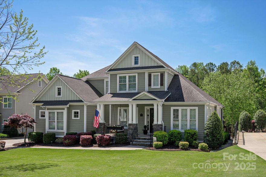 Welcome Home to the highly sought after Springfield neighborhood in Fort Mill, SC. This homes features the rocking chair front porch you dream of in the south; is situated on a private 1/2 acre wooded lot and equipped with a 3 car garage. The open main level design is complimented by a wall of light filled windows; soaring ceilings and cozy fireplaces that in turn make it ideal for the those that love to entertain. The heart of this home is undoubtedly the chef's kitchen, featuring a spacious Quartz island, SS appliances, wall oven & microwave, gas cooktop stove,walk in pantry; and soft close drawers and doors. Other Interior Features/Highlights - Hardwood floors; Primary and Guest Suite on main level; Built in bar; extensive moldings; Plantation shutters; 2 stacked stone fireplaces plus a stunning oversized screened porch with sitting&dining area along the back of the house; outdoor firepit & so much more.Don't miss your opportunity to call this well maintained Springfield home yours.
