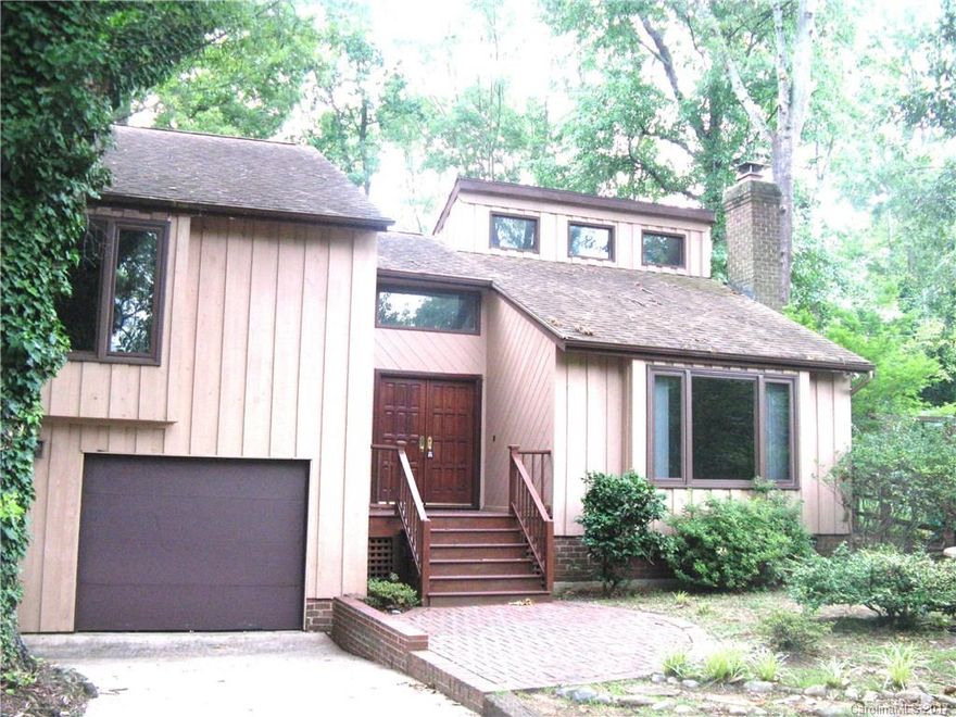 Well appointed private home, nestled in the convenient neighborhood of Raintree. Vaulted ceiling in living area, with open floor plan on a beautiful wooded lot.Spacious bedrooms upstairs, with open family room and den on the lower level, with a wet bar and various storage areas. Kitchen has granite counter tops and  is equipped with full appliance package and large window looking into the back yard.