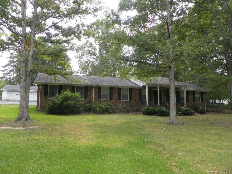 100% Financing Available! This home has been well taken care of. Kitchen has a breakfast area, Formal Dining and Living Room, Large Den w/built-in bookcases, gas fireplace. Three spacious bedrooms and two full baths. Lot size over an acre with 2 car garage and fenced yard. 25x22 detached garage/workshop that will make an excellent at home business. 2 attached storage rooms. Hardwood Floors under all carpet - Great Location and Awesome Price.