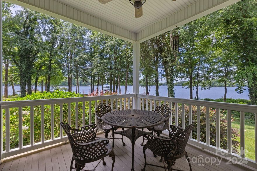 OPEN HOUSE July 20th 2-4PM - Beautiful Custom High Rock Lake front home w/ A RARE approx. 6 acres AND over 600 ft of waterfront! Wrap around rocking chair lakeside porch, one side screened in, the other side open with ALL gorgeous long range views!  Speakers & ceiling fans on both porches. Sealed crawlspace! Detached 2 car carport & 1 car garage.  12x18 storage shed.  Easy level walk to the dock and all waterfront.  Driveway and utility easements.  Roof 2021/HVAC upstairs and down 2023/Well pump and wiring 2020/On demand hot water heater 2019/Septic tank pump updated 2018/Irrigation system intake pump and PVC 2024!  Beautiful landscaping, sodded grass with irrigation!  Architect - Reid Link.  Pre-approved buyers welcome! This property is 2 parcels - 611005 & 611097