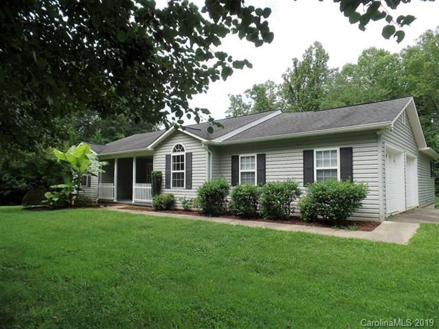 Located in the Springdale subdivision, this 3 bedroom 2 bath home  with a full basement and a 2 car garage is just right for the active family.  A spacious family room with a vaulted ceiling and a very functional kitchen with oak cabinets complete the main level. Hardwood floors in all but the bedrooms and baths on the main level add an attractive and low maintenance feature. New paint throughout, new master bedroom carpet, new counter tops and mostly new stainless steel appliances add to the updated look. The full basement has one finished room of +/- 352 SF. making this room perfect as a workout or bonus area. This property has a nice big back yard for many activities.  Springdale is conveniently located to downtown Marion and just a short distance to Lake James and all the recreational activities there.